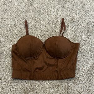 This is a brown corset crop top! Only worn once. Brand new.